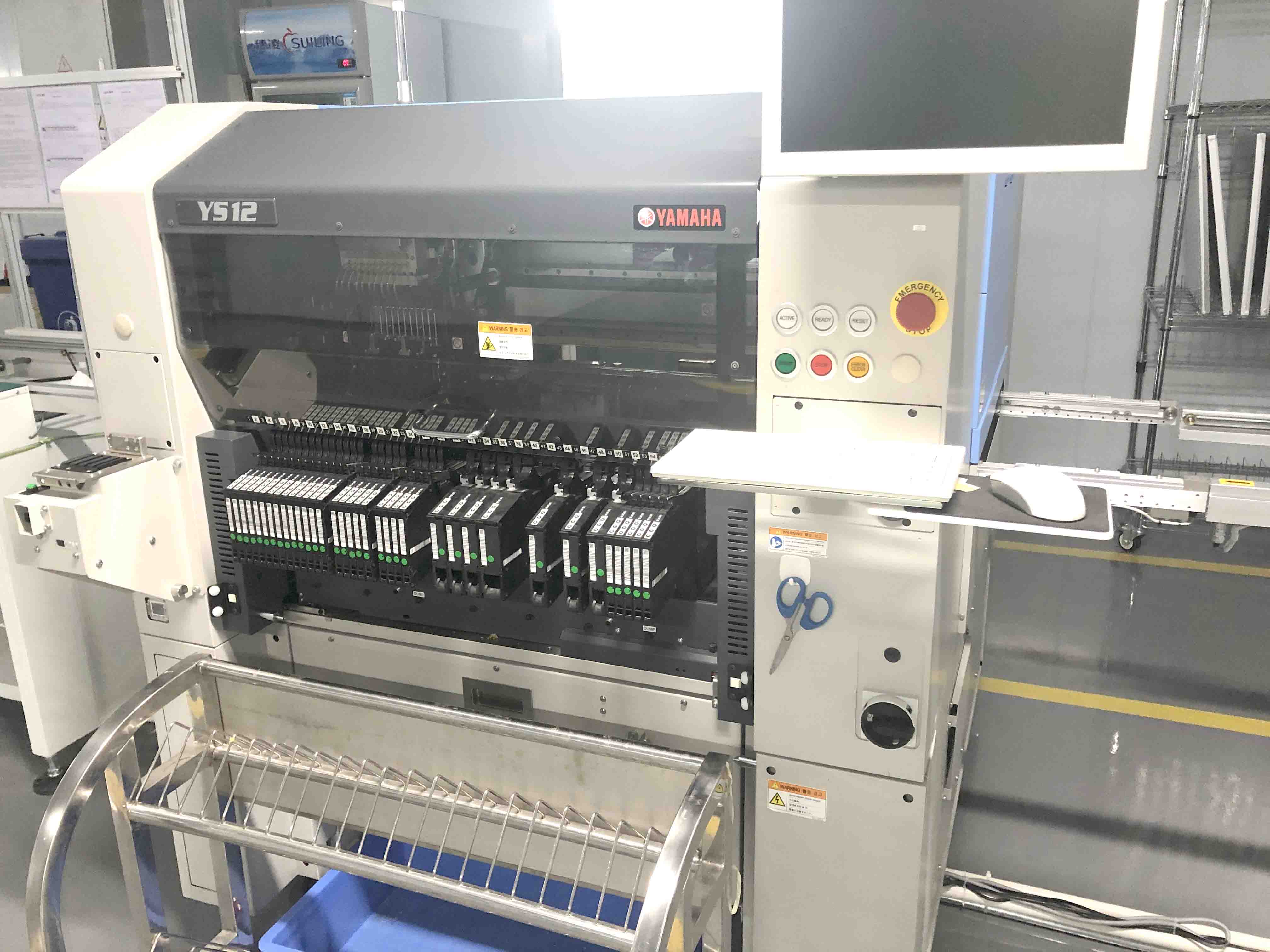 Side view of Yamaha YS12 SMT machine for electronics manufacturing